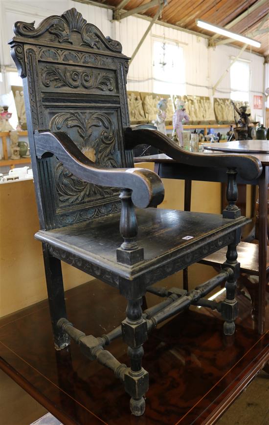 Carved oak elbow chair